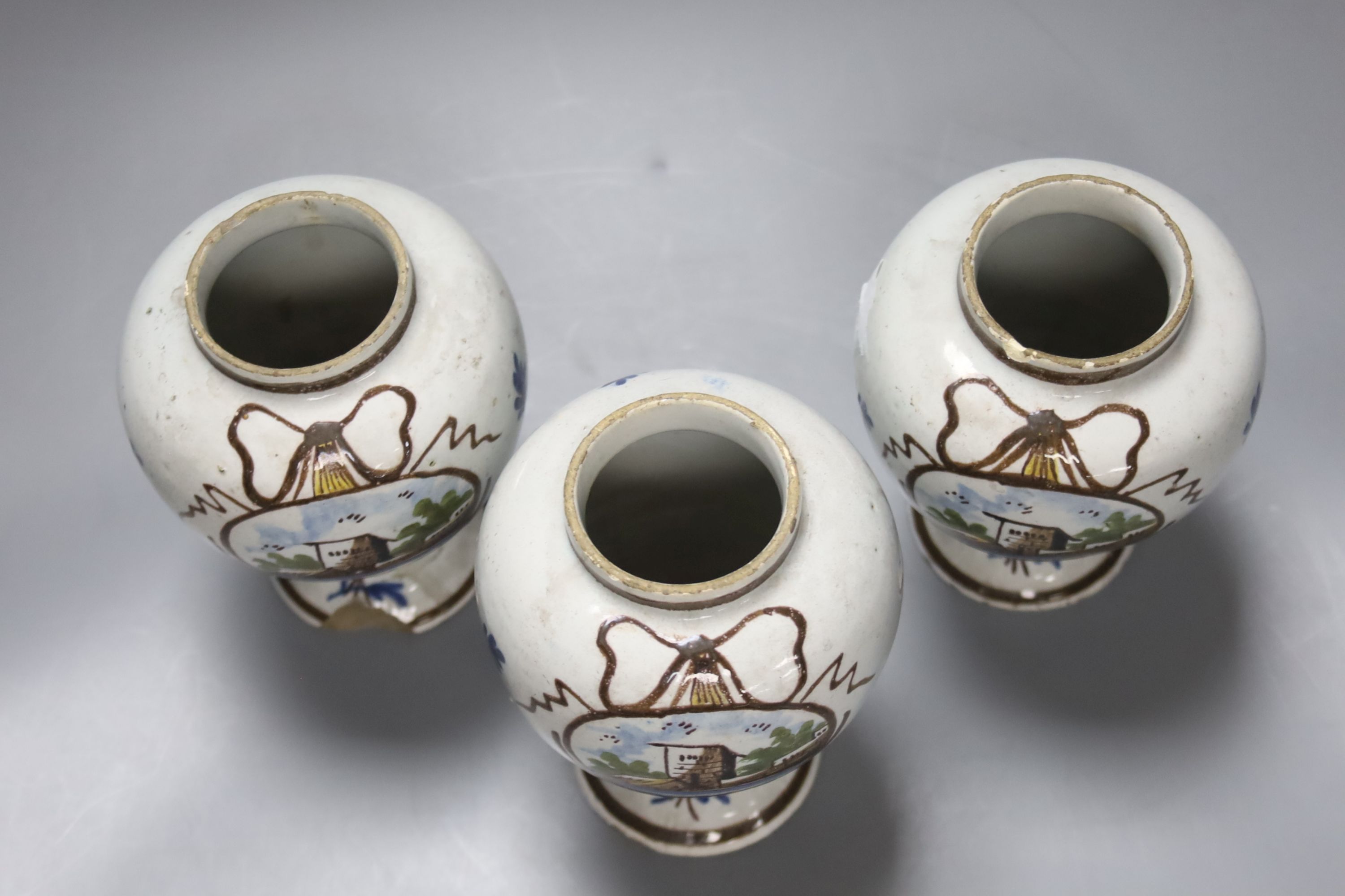 A set of three Dutch Delft baluster jars, first half 18th century, height 14cm